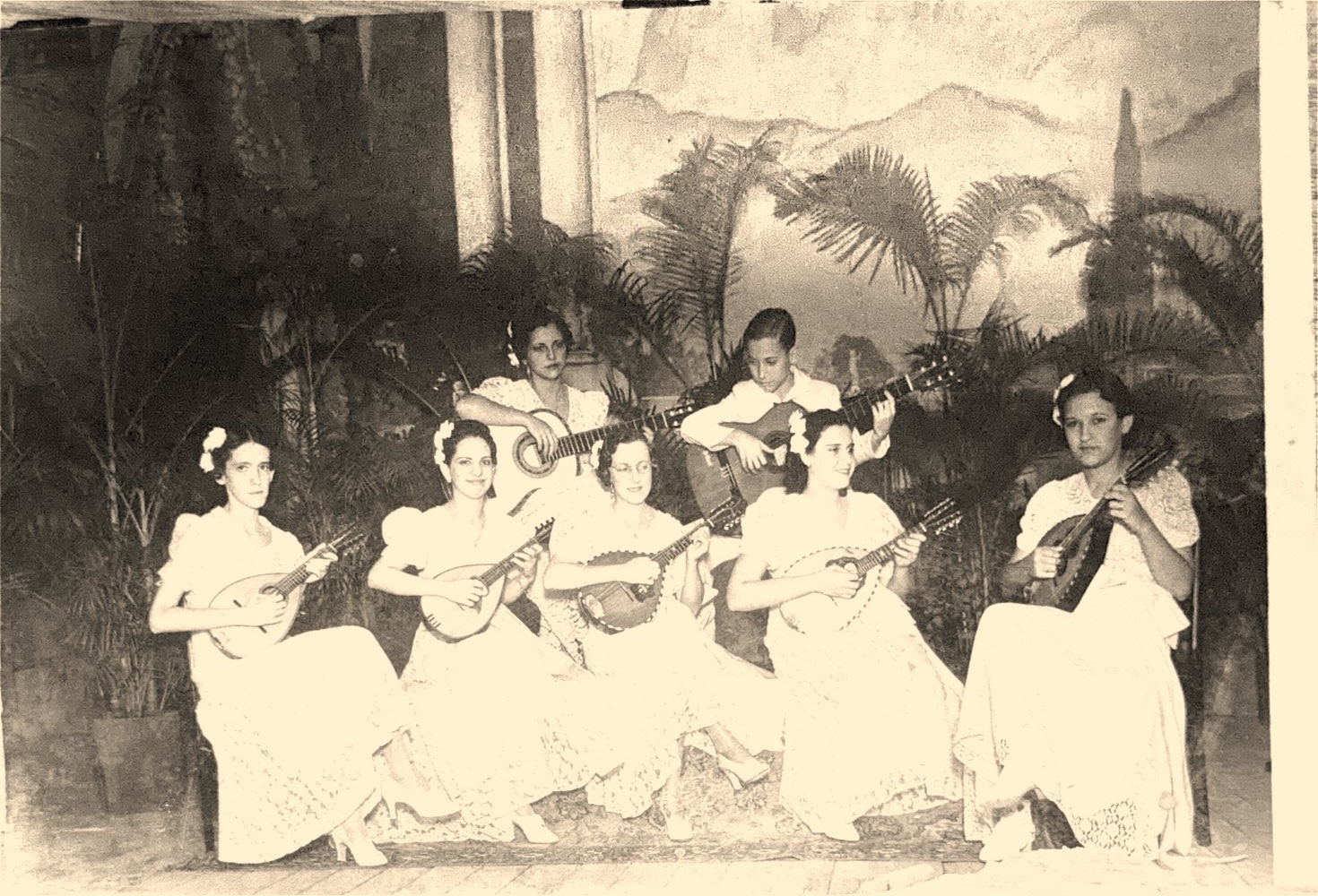 Family at carnival, in lace dresses with guitars
